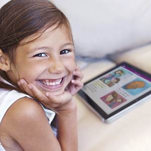 young girl using Raz-Kids on a tablet